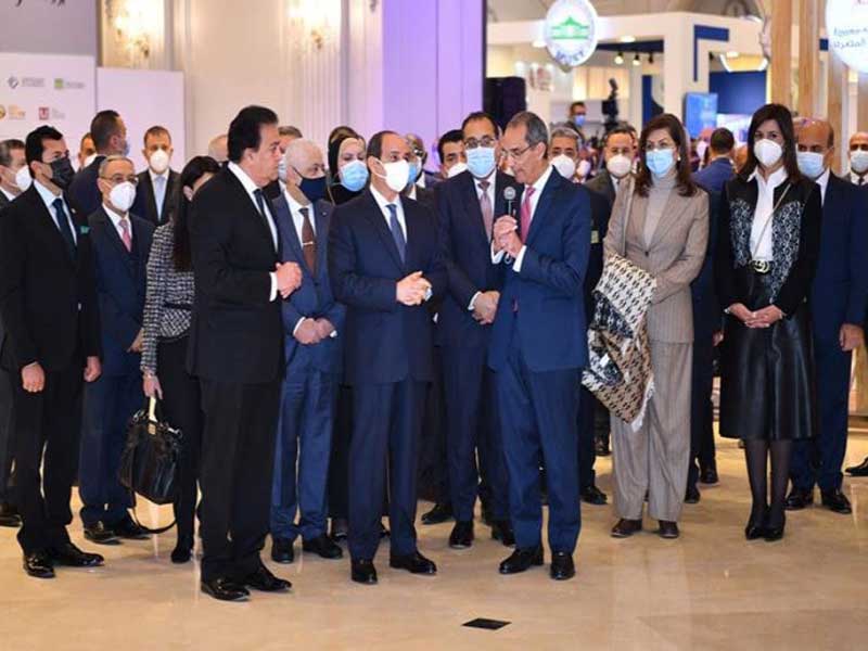 The President of Ain Shams University and the Vice President for Graduate Studies inspect the university's pavilion at the Global Forum of Higher Education