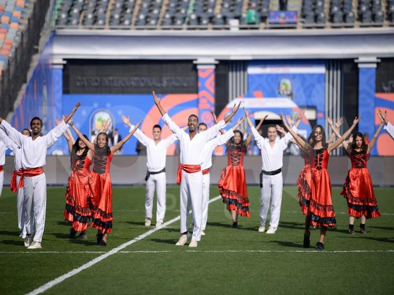 The folk arts team at Ain Shams University celebrates the opening ceremony of the African Cup of Nations in Cairo Stadium