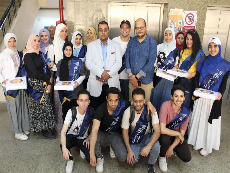 The family of Students for Egypt at Ain Shams University presents an Eid Al-Fitr biscuit to the children of El-Demerdash Hospital