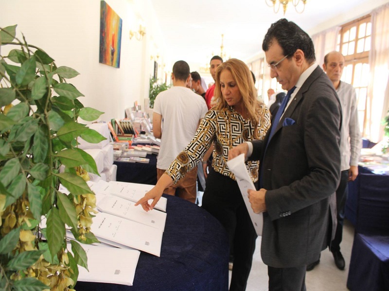 The Dean of the Faculty of Arts inaugurates the Book Fair at the faculty and inspects the exhibition booths amid a remarkable turnout of students